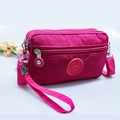 Mini rose red nylon crossbody bag with multiple zip compartments and sport logo - Rose Red