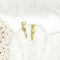 Macro shot of 18K gold plated lightning charms with micro-pave crystals for DIY jewelry - Slim Lightning