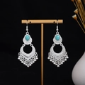 Close-up of vintage tribal silver earrings with turquoise stones and hollow tassel details - Silver Light Turquoise Tassel(E7272)