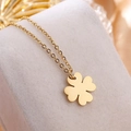 Minimalist golden four-leaf clover necklace on beige jewelry cushion high-end display - Gold (8403)