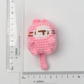 Handmade pink knitted cat doll keychain showing dimensions with rulers about 11cm long - Pink Knitted Flat Cat