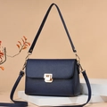 Dark blue crossbody bag with lychee pattern leather and gold metal buckle detail - Blue