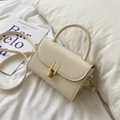 Cream white leather crossbody flap bag with golden buckle and sleek top handle - White