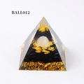 Orgone pyramid variant BALL012 with white crystal ball, golden lotus and black gravel - Ball012