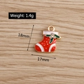 Detail showing 18x17mm red Christmas sock pendant with weight 1.4g measurement on wood background - Rhinestone Christmas Sock (YD139)
