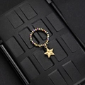 Detail of beaded elastic ring with gold star pendant and colorful faceted beads - Multicolor Bead Pentagram Style (F-R584)