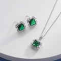 Detailed close-up of emerald square halo necklace and earrings jewelry set on a white stand - Silver Square Green (HQ0001(21))