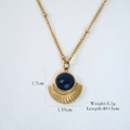 Detailed close-up of a 14K gold plated necklace with a fan-shaped blue gem pendant - Fan Shaped Black Agate