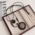 Bohemian retro long necklace with round wood pendant and gold metal spiral details - Wood/Alloy/Wax Rope / Round Wood Spiral Bow Style (2#)