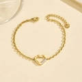 Elegante pulsera de corazón en acero inoxidable dorado con grabado LOVE y circonitas - Pulsera - Dorado