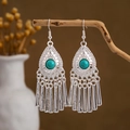 Macro detail of bohemian silver earrings with turquoise stones and peacock tassels - Silver Turquoise Tassel(E2875-42)