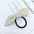 Elegant beige faux leather bow hair tie with a durable black elastic band - Off White