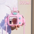 Detailed view of 600ml pink camera-shaped water bottle with strap and rabbit ears - 600ml / Pink