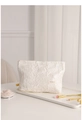 Detail of white embossed floral jacquard makeup bag on tray with soft lighting - Large / Jacquard Moon White