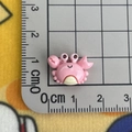 Detail view of pink resin crab charm on scale showing 1.5cm size for DIY crafts - Crab