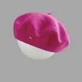 Rose pink wool beret with a gold oval metal accent on a mannequin head stand - M (56-58cm) / Rose Red