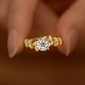 Laurel branch ring with leaf-shaped band and sparkling moissanite flower design - US 7 / Gold