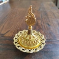 Middle Eastern style golden hollow resin incense burner with an elegant flame top - Pointed Toe