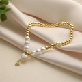 Bracciale elegante con perle dorate e ciondolo a chiave a cuore su tessuto di seta - Stile Chiave Cuore