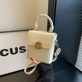 Chic white crossbody phone bag featuring a gold knot buckle and chain handle - Off White
