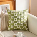 Green luxury embroidered throw pillow with 3D white floral patterns on a leather sofa - Green Floral