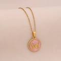 Macro detail of golden round pendant featuring a pink background with relief butterfly - Pink Round Style (#5 Pink)