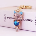 Cute lucky cat keychain with white rhinestones and a large dark blue crystal pendant - Lake Blue