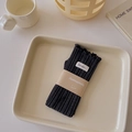 Dark grey knitted arm warmers with lettuce edge trim and small decorative fabric label - One Size / Dark Gray