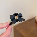 Elegant black bow hair clip with gold flower center detail for women's hairstyle - Black Small Camellia Bow Hair Claw / Black