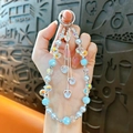 Exquisite blue pearl beaded phone strap with iridescent crystals and heart charms - Blue