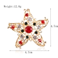 Star-shaped golden Christmas brooch with red, green, and white crystals 4.7cm - xz4175 Christmas Star