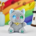 Detailed view of a cute grey plush cat keychain with a bell collar and heterochromia eyes - Gray