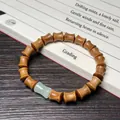 Bracelet en bois de santal en forme de bambou avec perle de jade sur calligraphie - Santal Vert 8x10mm Forme de Bambou avec Perle de Jade