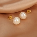 Detailed macro view of white freshwater pearl earrings on elegant champagne silk fabric - ER1438-A Simple Stud Pearl Earrings