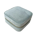 Portable light blue velvet travel jewelry box with golden zipper and square shape - Teal