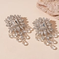 Macro shot of silver tassel earrings with diamond flowers and crystal fringe detailing - Silver Geometric Flower Ear Drops (Silver Needle)