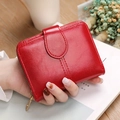 Short red faux leather wallet for women with zip closure and multi-card slots - Red