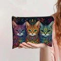 Handheld view of a large canvas makeup bag featuring vibrant artistic cat print patterns - Artistic Painted Cats (jiaying005)