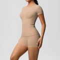 Close-up of nude seamless yoga set with slimming short sleeve t-shirt and high stretch shorts - S / Top And Bottom / Medium Khaki