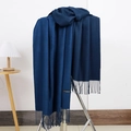 Detailed view of dark blue cashmere scarf with fringe hanging on a metal hanger - No.17 Navy Blue