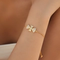 Elegant gold-plated adjustable bracelet featuring diamond-encrusted fan-shaped charms on wrist - Fan Shape Design (KB0689)