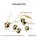 Detailed view of golden stainless steel jewelry set with black enamel and modern patterns - Black Enamel Irregular Geometric 4-Piece Set (KS226958-LX)
