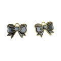 Detail of pair of black enamel bow pendants with gold metal edges for DIY jewelry making - Black