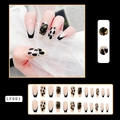 Detail view of long French nails with black tips, leopard print, and gold foil texture - LF001 Black Nude Leopard Gold Foil