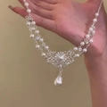 Close-up of pearl and rhinestone flower necklace with a teardrop pendant in silver finish - 3# Silver Double Layer Pearl Style