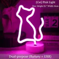 Pink cat-shaped neon LED light with round base and dual USB or battery power source - Cat Pink Light