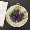 Three handmade purple wool felt grape keychains with cute smiling faces and green leaves - Grape Trio