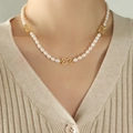 French style pearl necklace with golden butterfly pendants worn by model on knitwear - Gold Butterfly Pearl Necklace (P1363) / 40+5cm