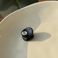 Detailed close-up of a mini black hair claw clip with a billiard 8 ball design on ceramic - Black/No.8