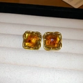 Close-up of vintage square amber resin earrings with golden rope twist borders - 1# Gold Coffee Square